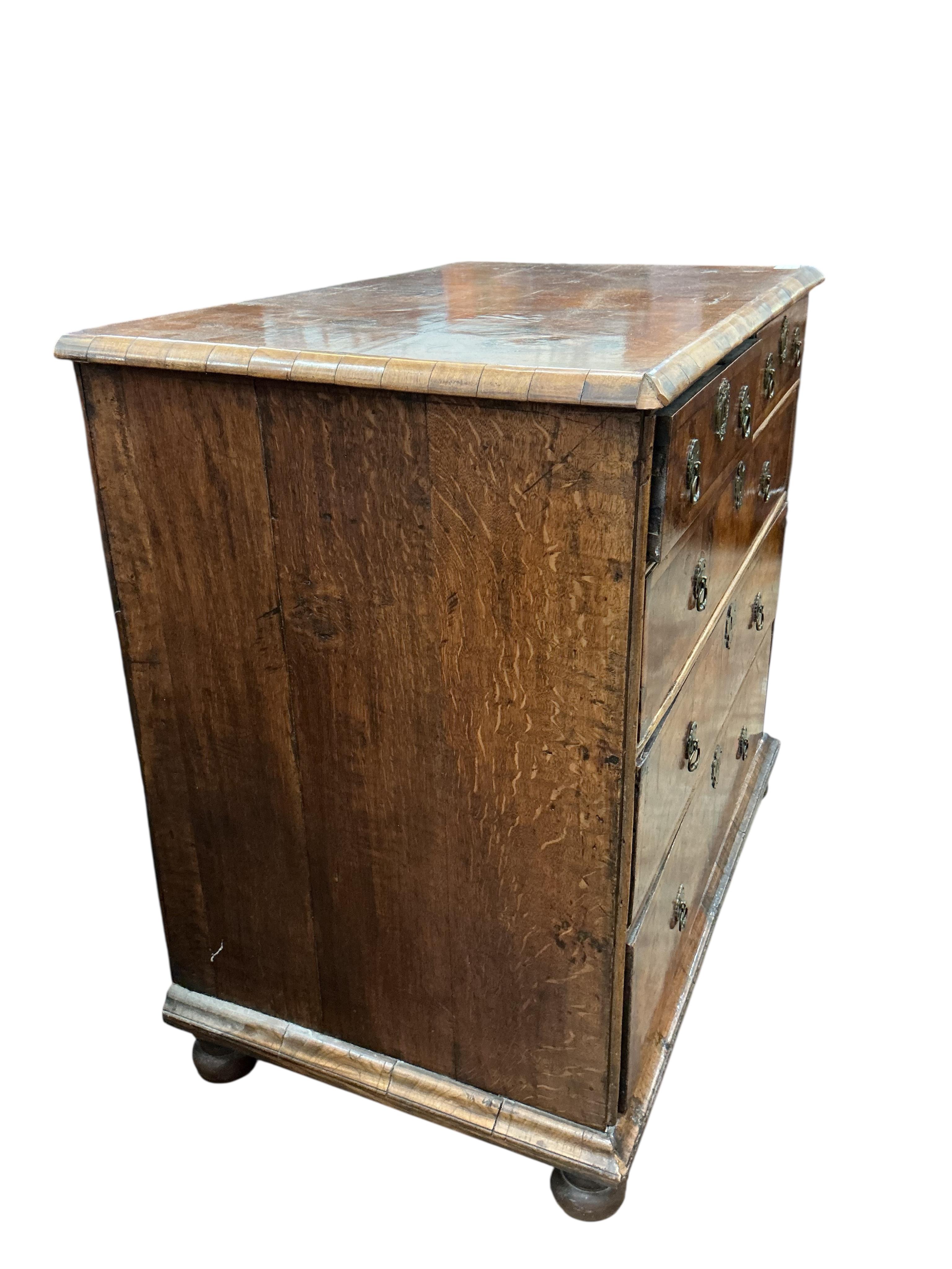 A Queen Anne walnut chest, with bun feet, width 92cm, depth 55cm, height 86cm